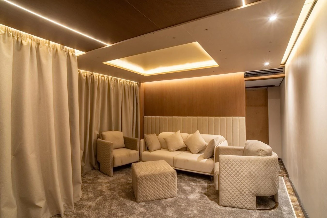 The yacht's interior features a cozy lounge area with plush seating and warm lighting. aboard JASMINE Yacht for Sale