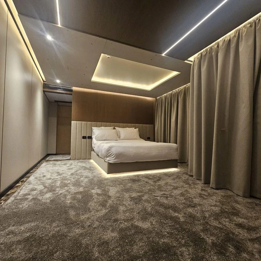 A luxurious stateroom with a modern design and ambient lighting. aboard JASMINE Yacht for Sale