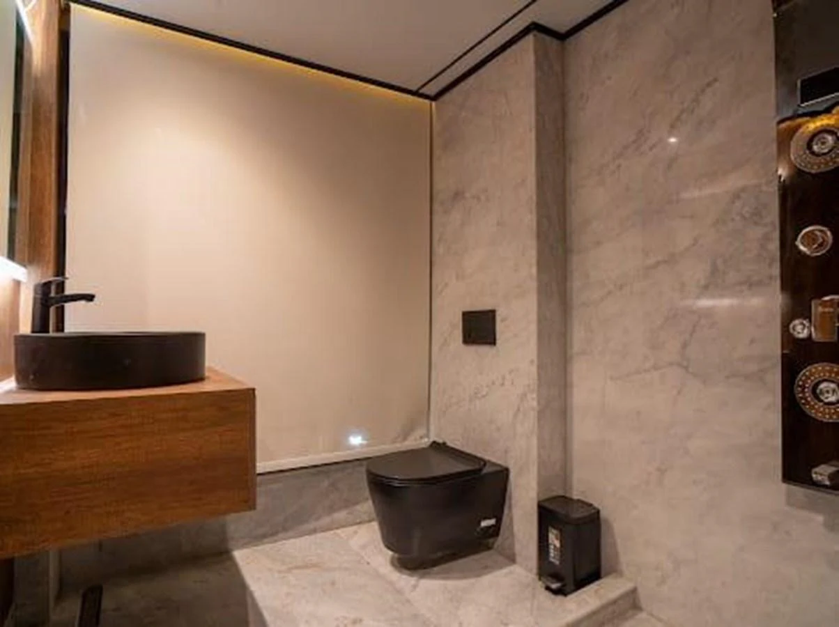 The yacht's bathroom features modern fixtures and a sleek design with marble finishes. aboard JASMINE Yacht for Sale