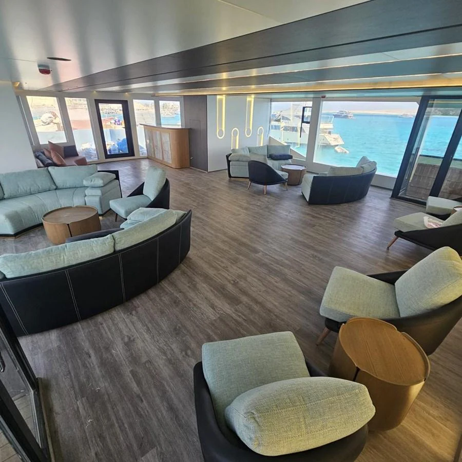 The spacious salon offers panoramic views and modern furnishings for ultimate relaxation. aboard JASMINE Yacht for Sale