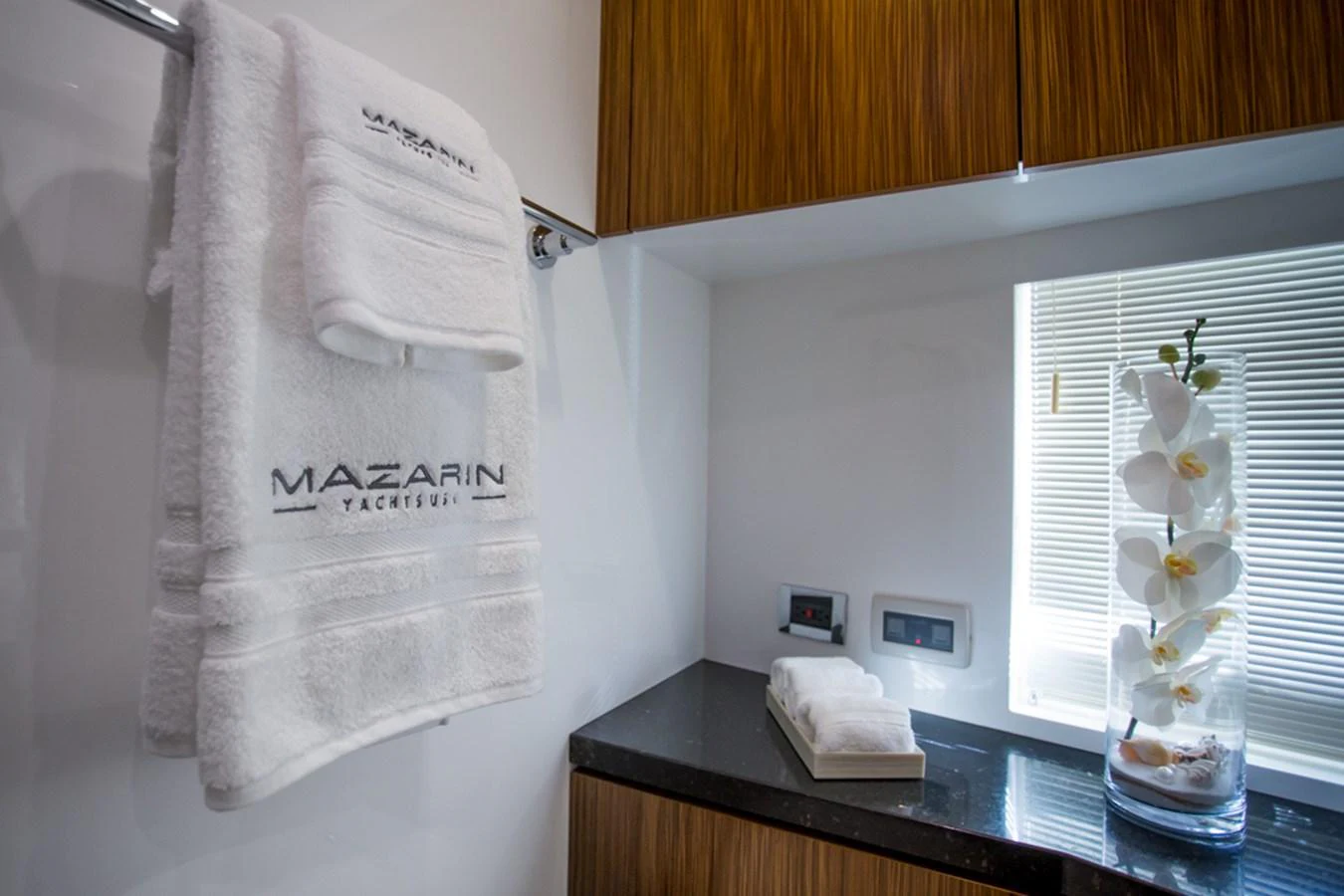 The yacht's bathroom features luxurious towels and elegant decor. aboard MAZARIN 72 FLYBRIDGE Yacht for Sale