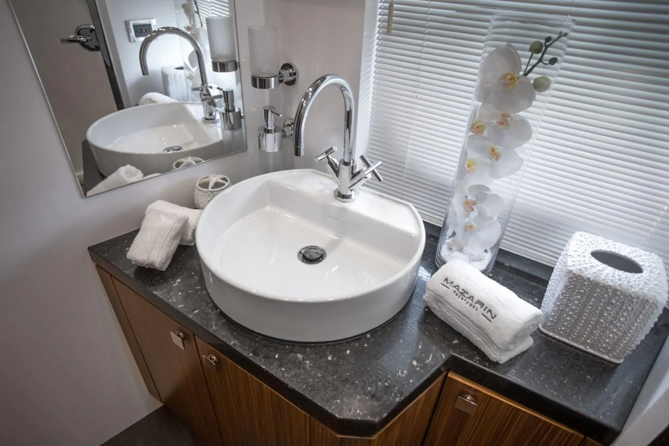 A stylish bathroom with a modern sink and elegant decor. aboard MAZARIN 72 FLYBRIDGE Yacht for Sale