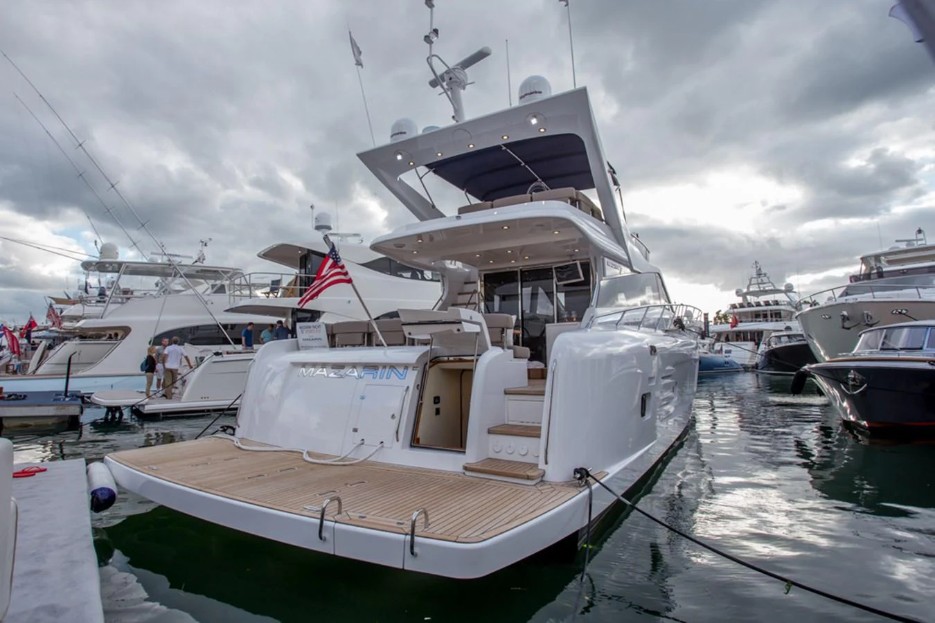 The yacht's aft deck features a spacious swim platform and elegant steps leading to the main deck, perfect for leisurely waterfront activities. aboard MAZARIN 72 FLYBRIDGE Yacht for Sale