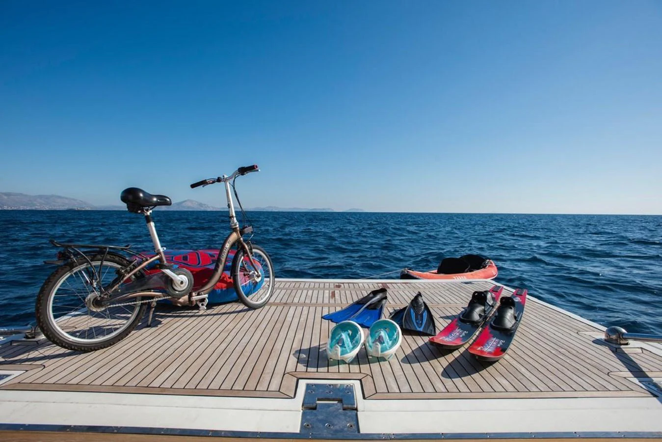 The swim platform is equipped with various water toys and a bicycle, perfect for an active day on the water. aboard FERRETTI 881 Yacht for Sale