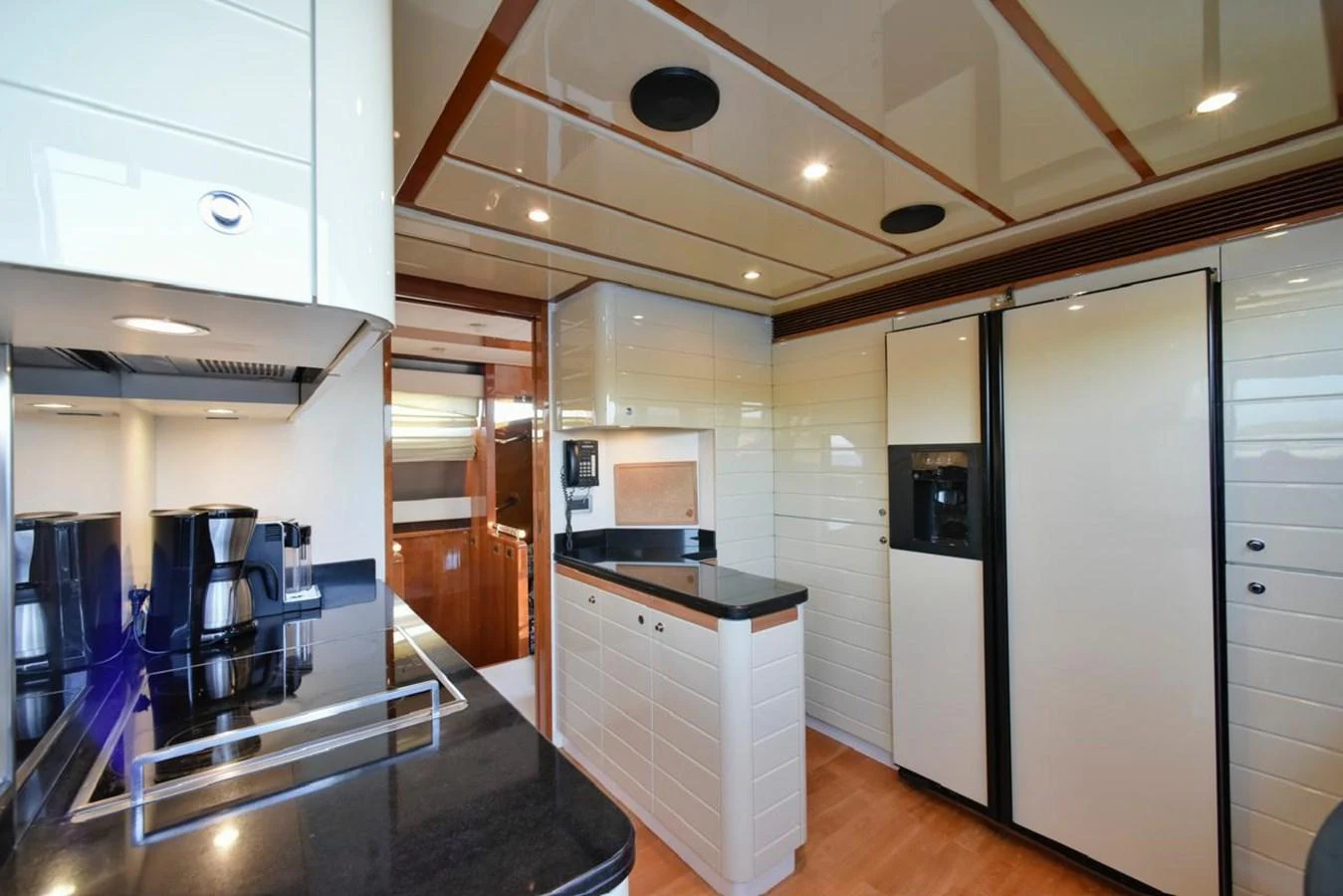 The galley features modern appliances and sleek cabinetry, perfect for gourmet cooking at sea. aboard FERRETTI 881 Yacht for Sale