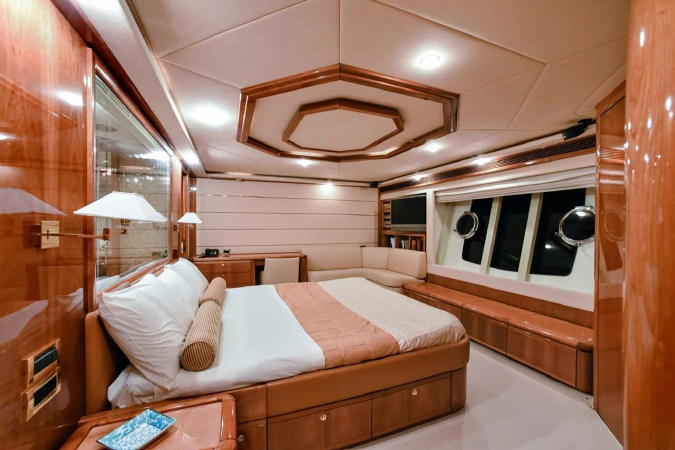 The master stateroom features luxurious wood finishes and ample natural light. aboard FERRETTI 881 Yacht for Sale