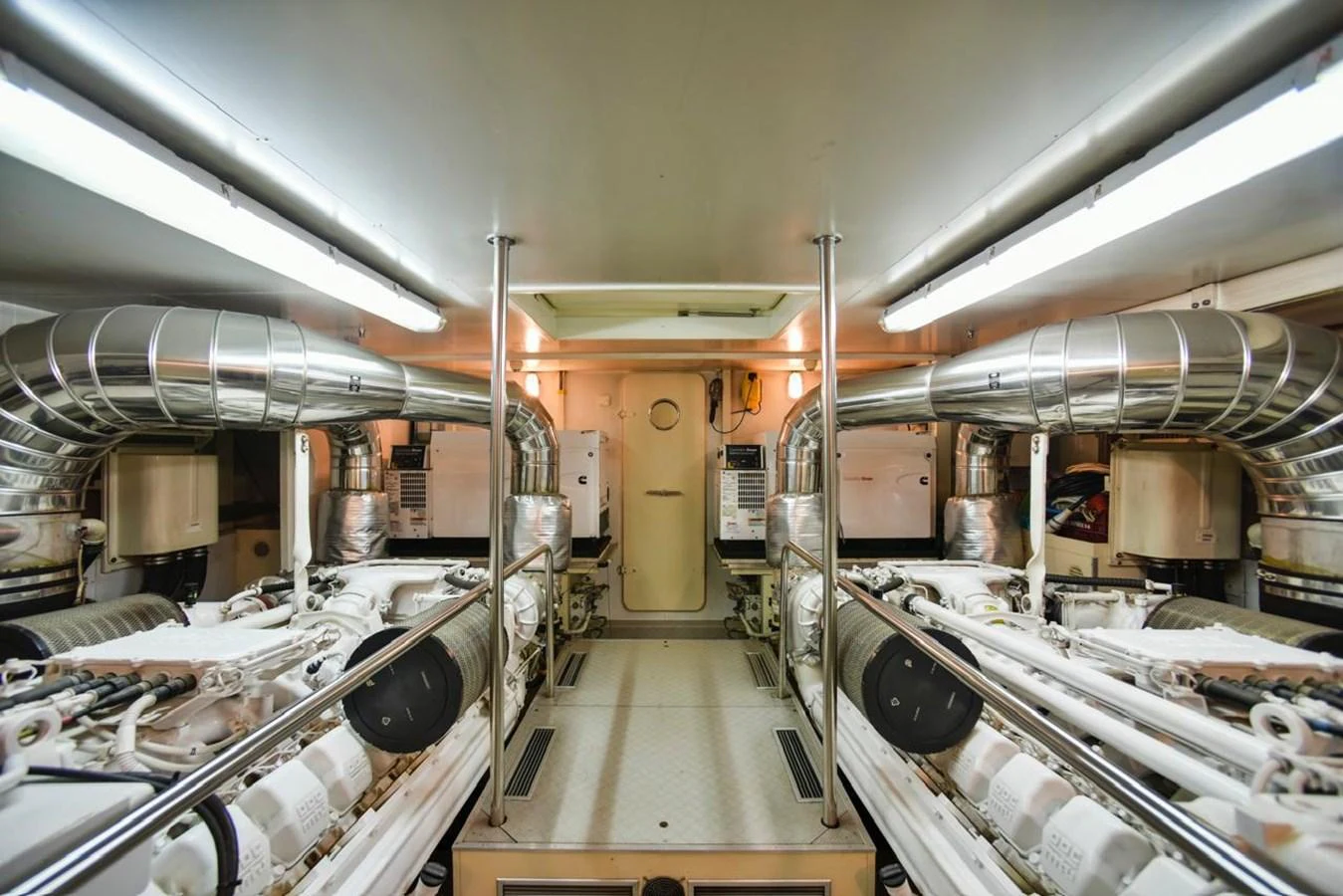 The image showcases a pristine and well-organized engine room with advanced machinery and polished metal surfaces. aboard FERRETTI 881 Yacht for Sale