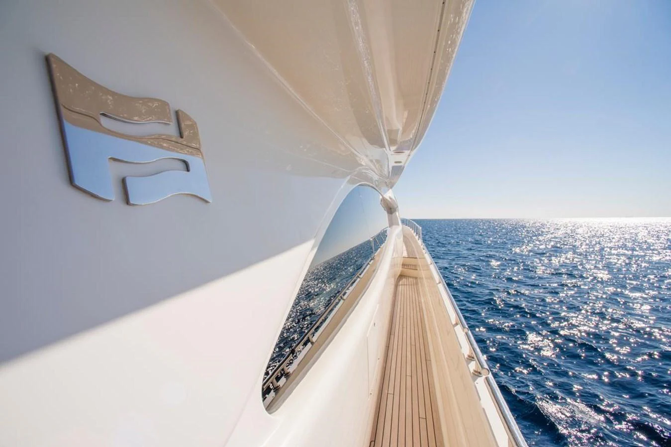 The sleek exterior of the yacht glides gracefully over the sparkling sea. aboard FERRETTI 881 Yacht for Sale