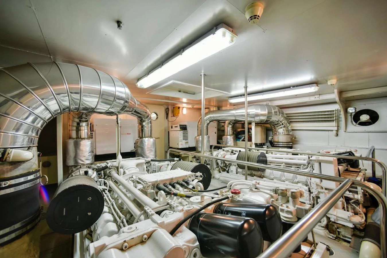 The image showcases the yacht's well-maintained engine room with advanced machinery and equipment. aboard FERRETTI 881 Yacht for Sale