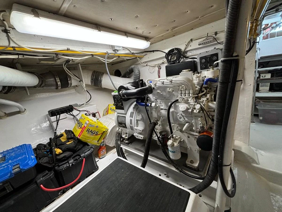 The image showcases the yacht's well-maintained engine room with various tools and equipment. aboard ADDISYN ANN Yacht for Sale