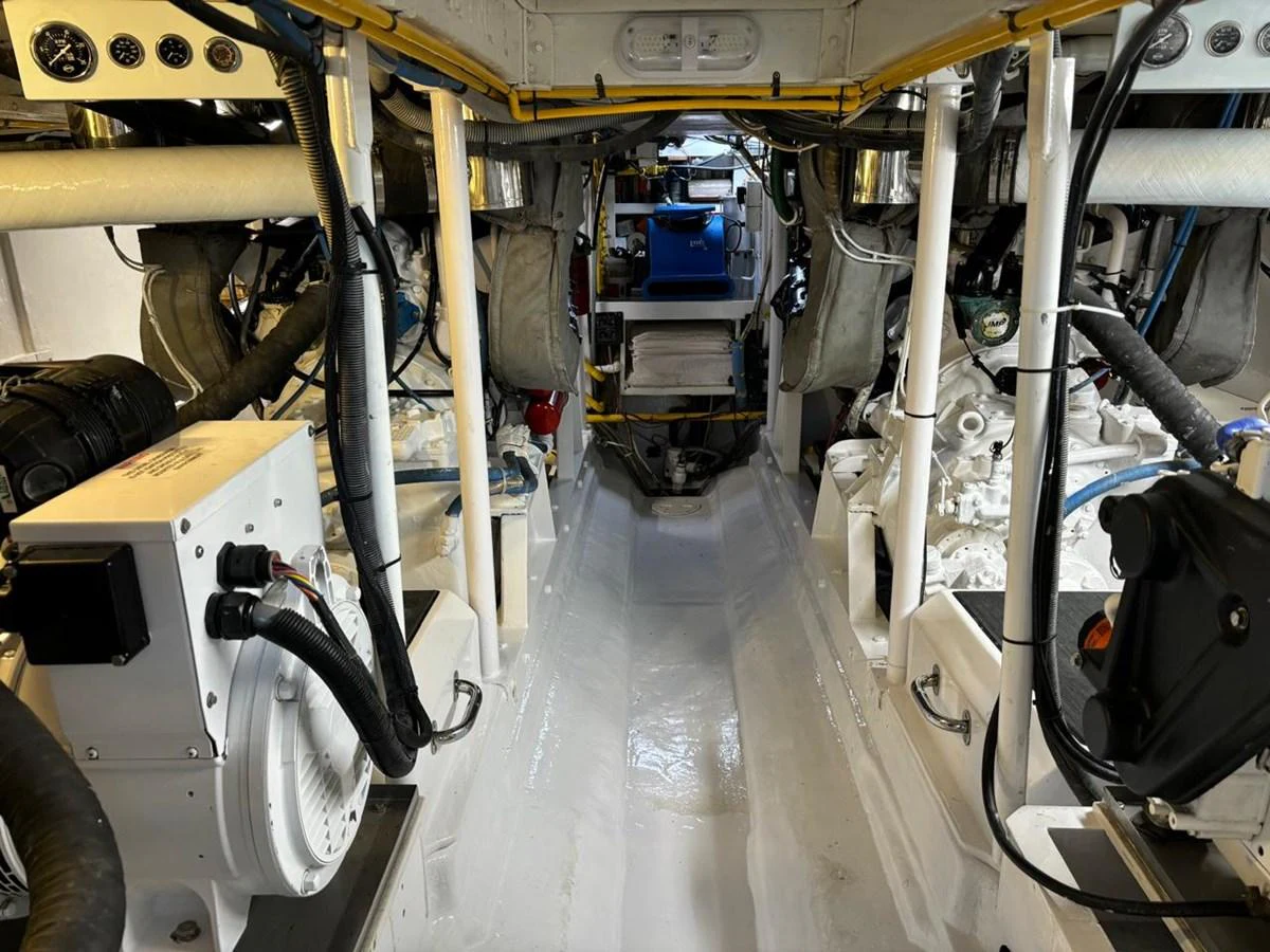 The image showcases the well-maintained engine room of the yacht, featuring various mechanical components and equipment. aboard ADDISYN ANN Yacht for Sale