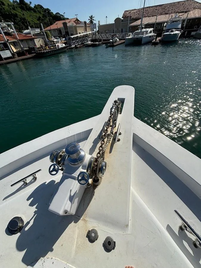 The image captures the bow of a yacht, showcasing the anchor chain and windlass mechanism. aboard ADDISYN ANN Yacht for Sale