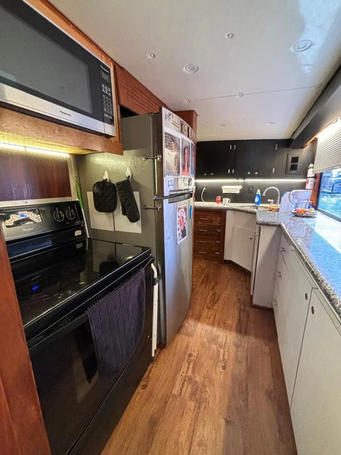 The galley features modern appliances and ample counter space for meal preparation. aboard ADDISYN ANN Yacht for Sale