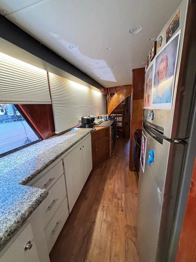 The yacht's galley features modern appliances and ample counter space, creating a functional and inviting cooking area. aboard ADDISYN ANN Yacht for Sale