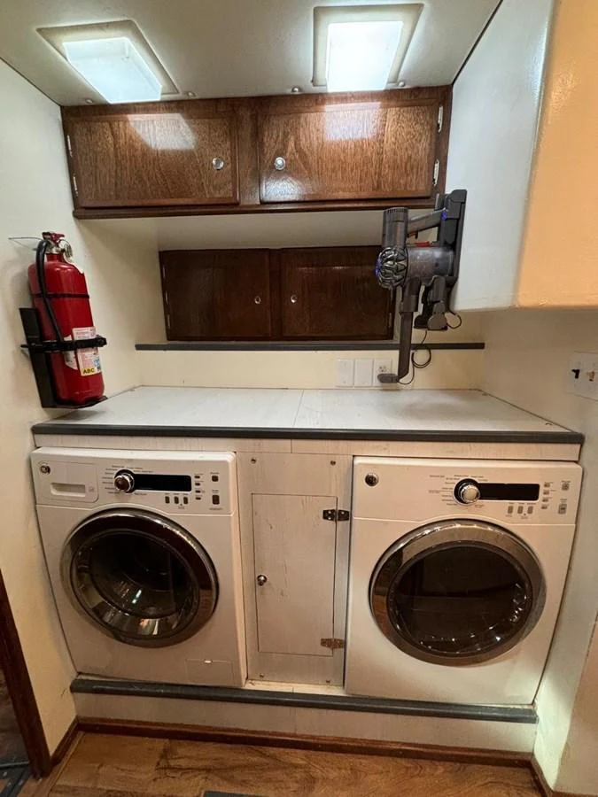 The yacht's laundry room features modern appliances and ample storage space. aboard ADDISYN ANN Yacht for Sale