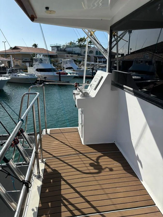 The aft deck of the yacht offers a serene view of the marina, perfect for relaxation. aboard ADDISYN ANN Yacht for Sale