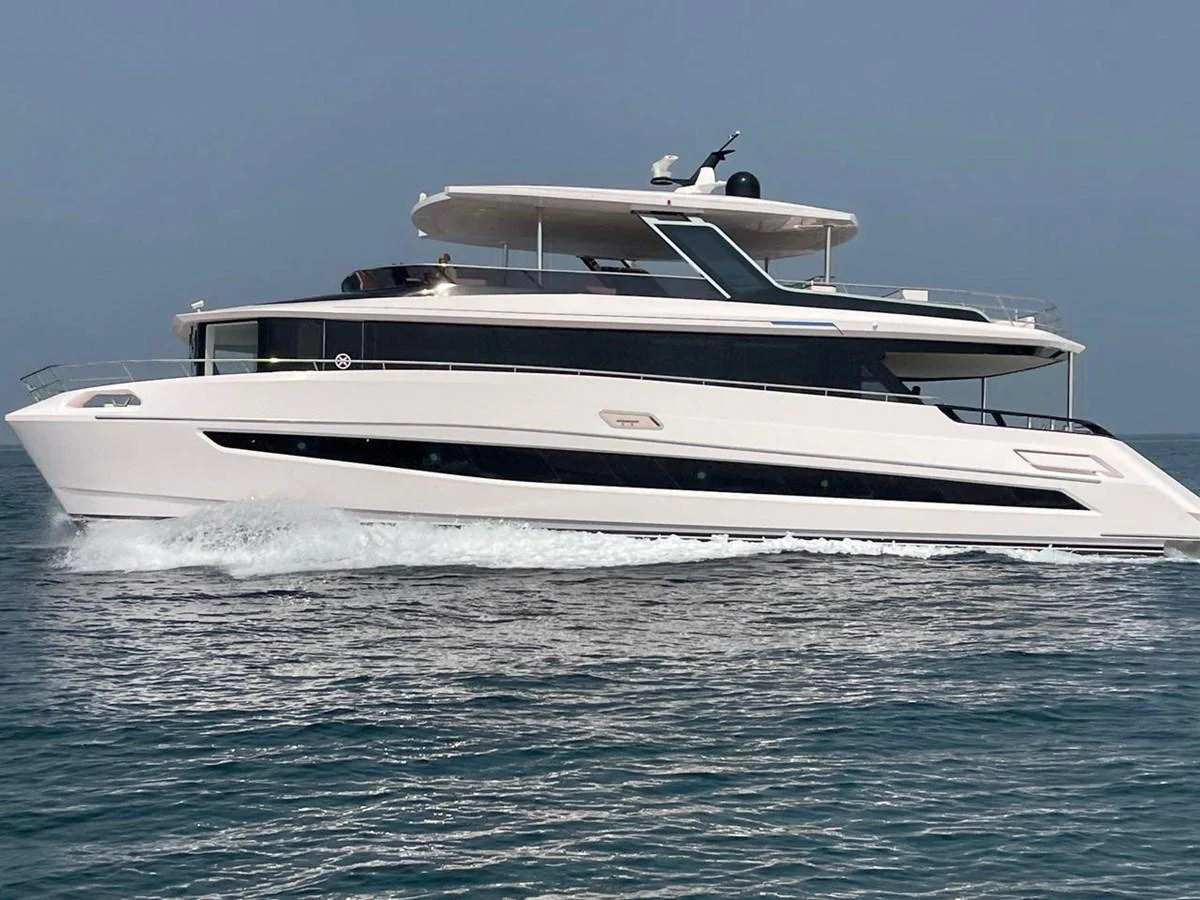 a white yacht in the water aboard XCEL 70 Yacht for Sale