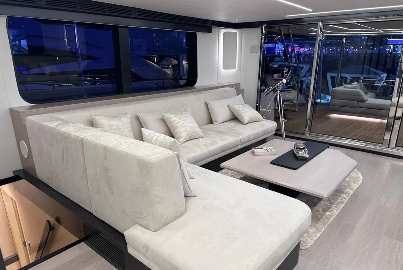 a living room with a large window aboard XCEL 70 Yacht for Sale