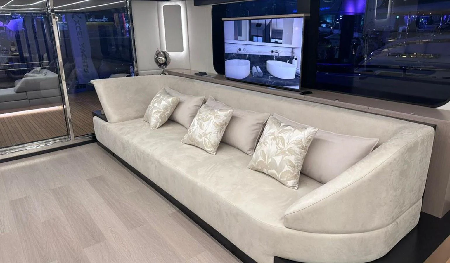 a couch with pillows aboard XCEL 70 Yacht for Sale