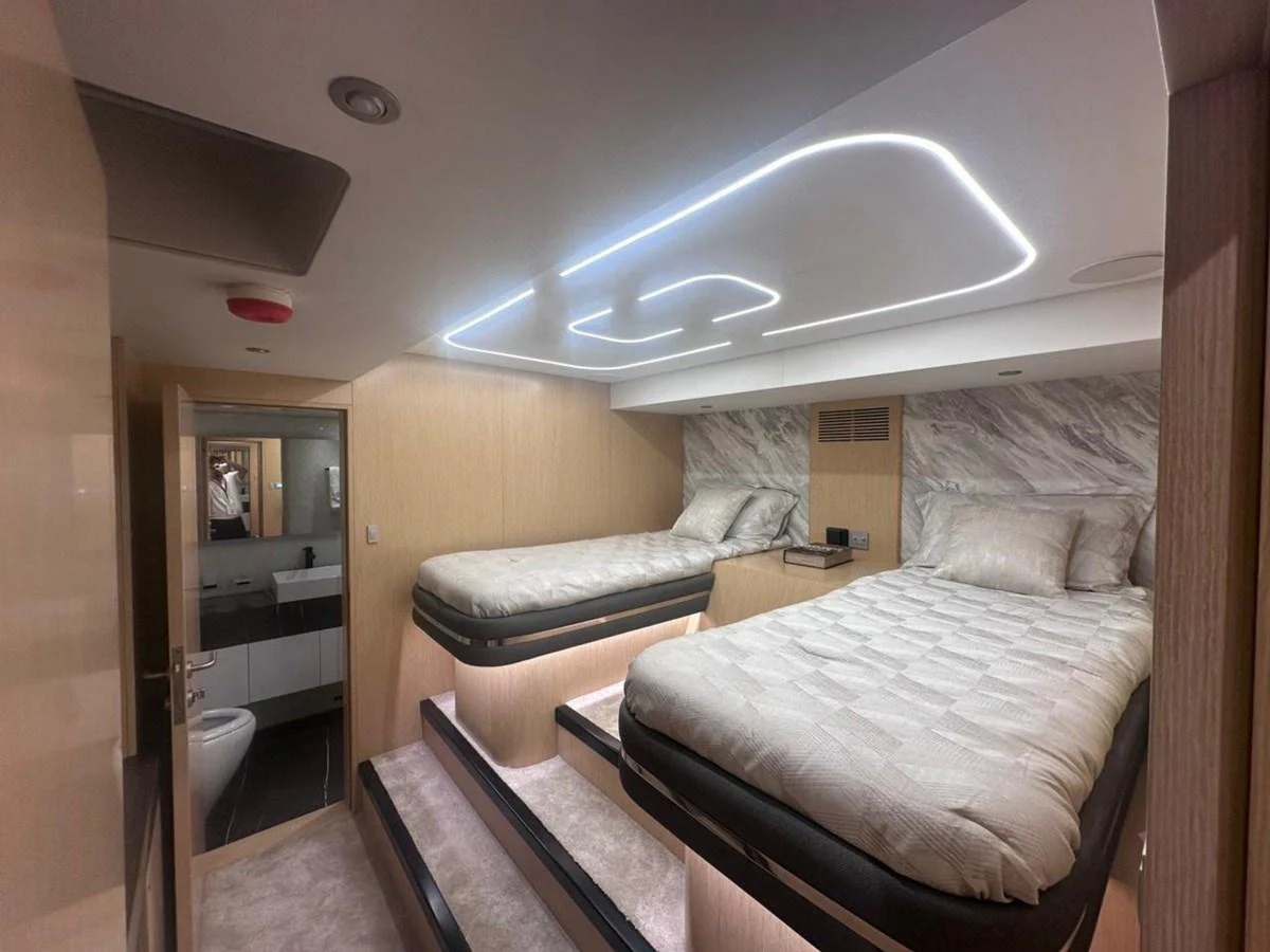 a room with a bed and a couch aboard XCEL 70 Yacht for Sale