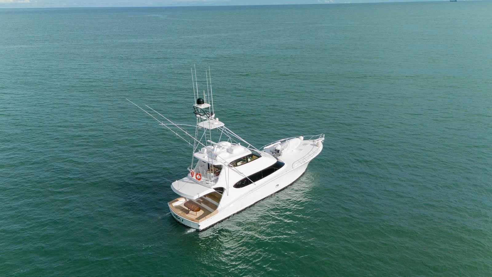 A sleek yacht cruises gracefully on calm, open waters. aboard VIDA 1 Yacht for Sale