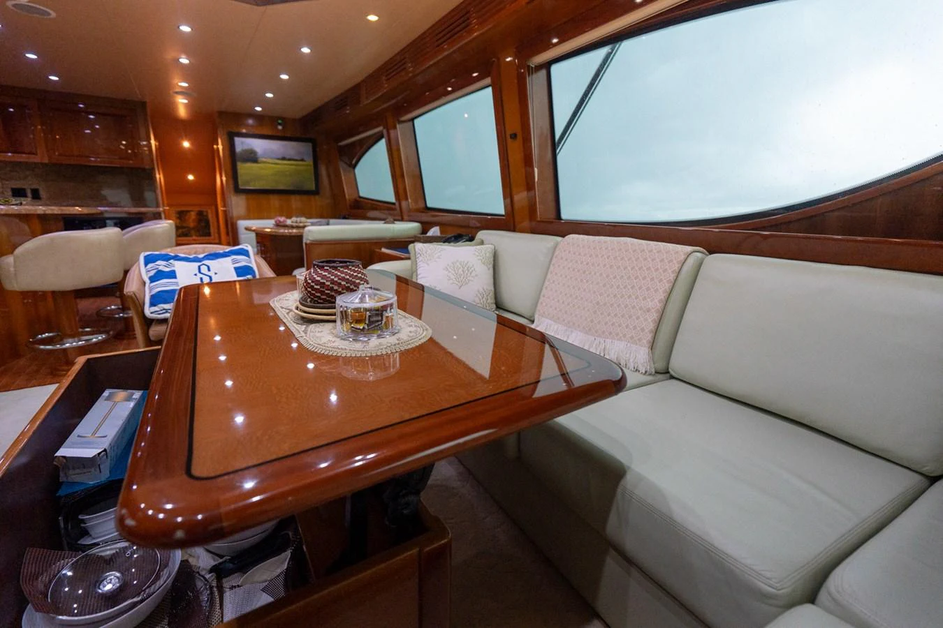 The yacht's salon features a comfortable seating area with large windows offering ample natural light. aboard VIDA 1 Yacht for Sale