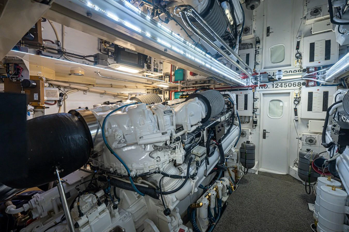 The image showcases the well-maintained engine room of the yacht, highlighting its powerful machinery and organized layout. aboard VIDA 1 Yacht for Sale