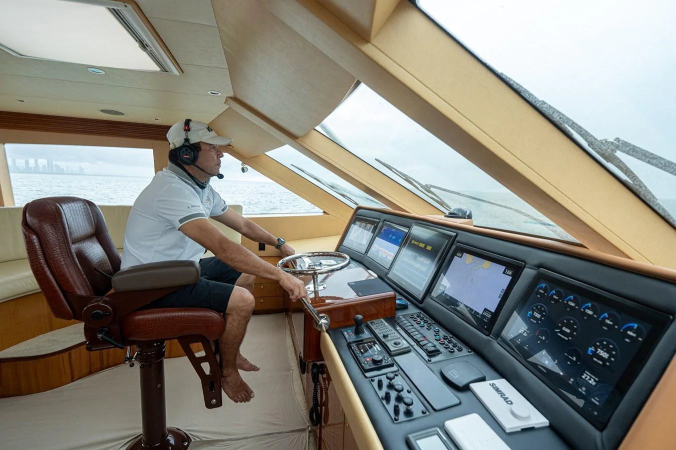 The helm station features advanced navigation equipment and a comfortable captain's chair, offering a commanding view of the sea. aboard VIDA 1 Yacht for Sale