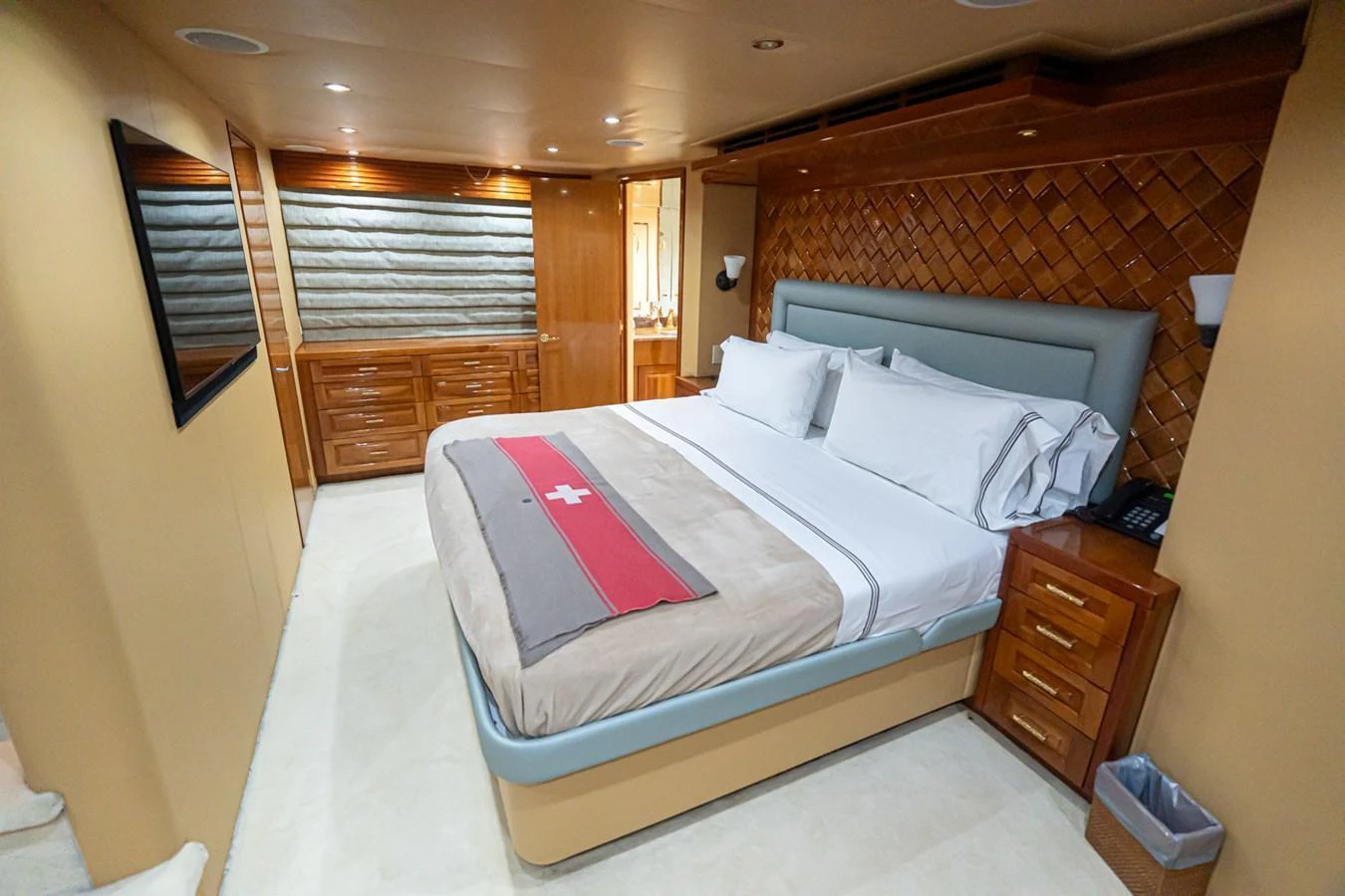 The stateroom features a large bed with luxurious linens and ample storage space. aboard VIDA 1 Yacht for Sale
