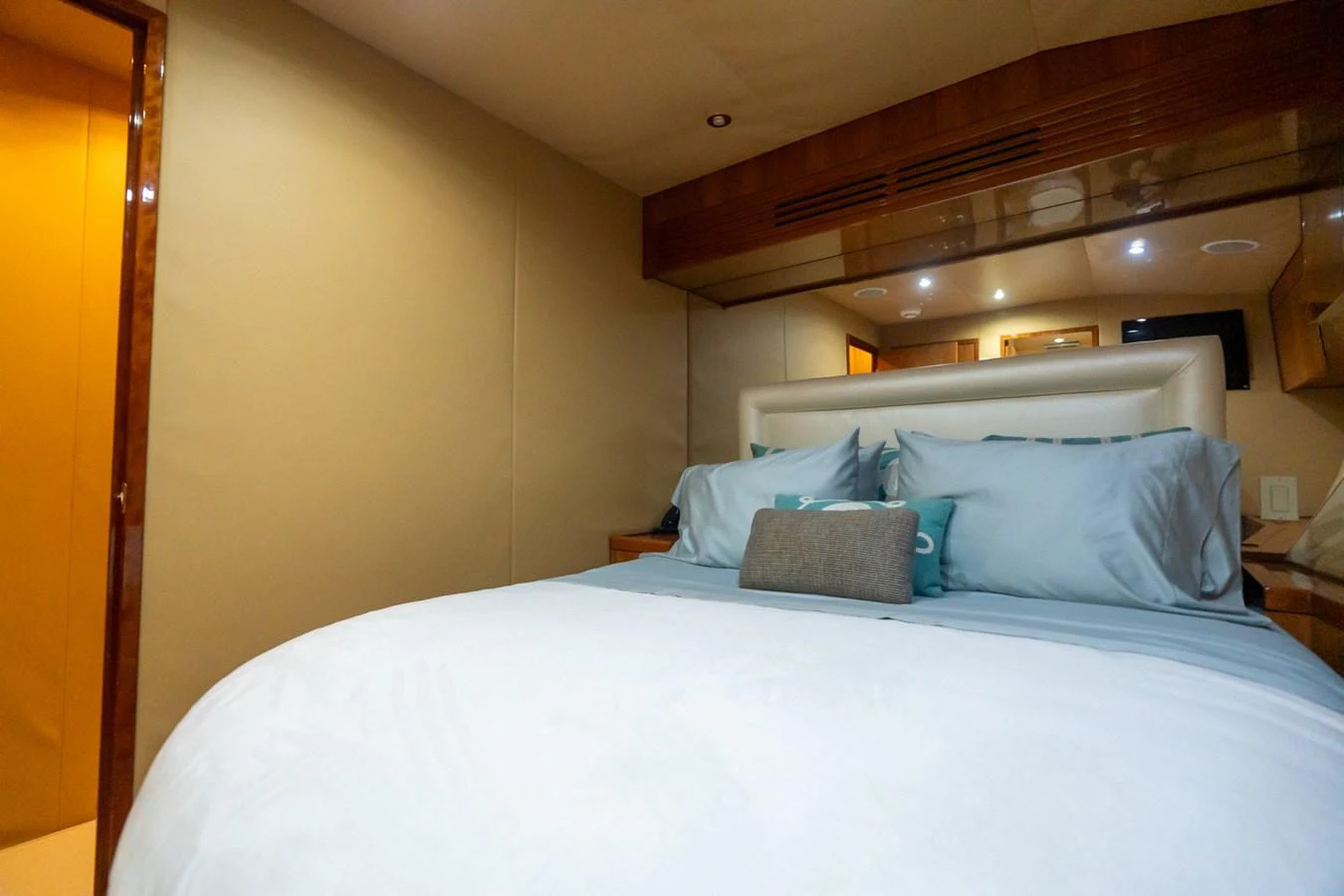A cozy stateroom with a plush bed and soft lighting. aboard VIDA 1 Yacht for Sale