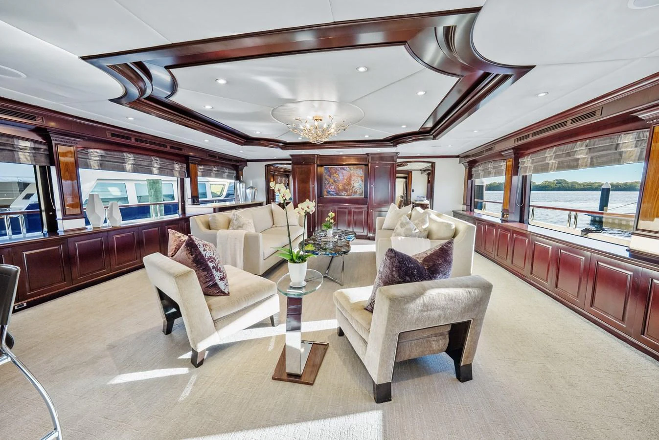 a room with a couch and a table aboard NICOLE EVELYN Yacht for Sale