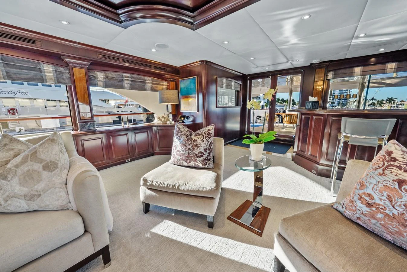 a living room with couches and a coffee table aboard NICOLE EVELYN Yacht for Sale