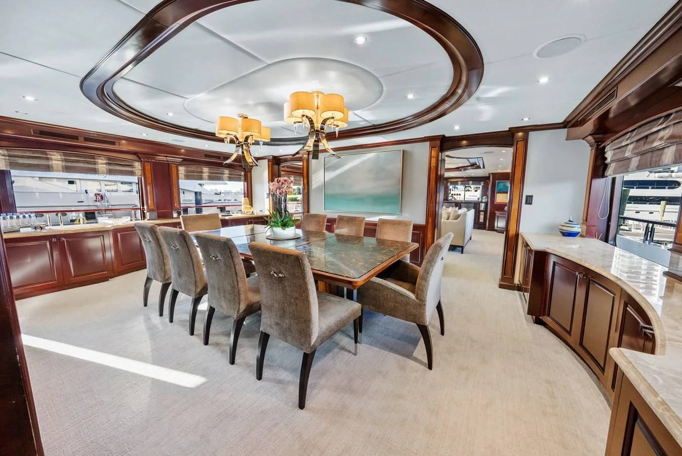 a large room with a table and chairs aboard NICOLE EVELYN Yacht for Sale
