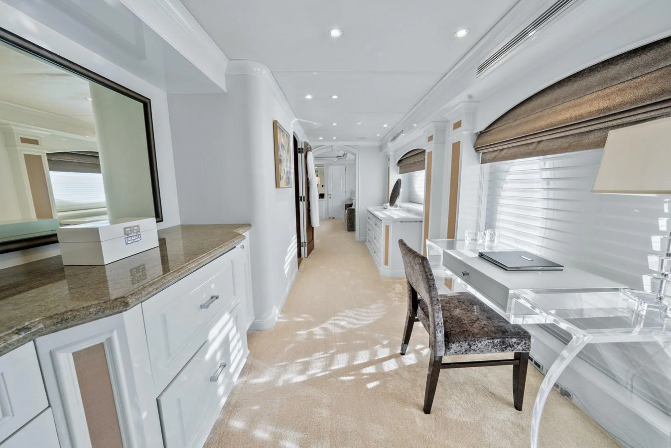 a room with a desk and chairs aboard NICOLE EVELYN Yacht for Sale