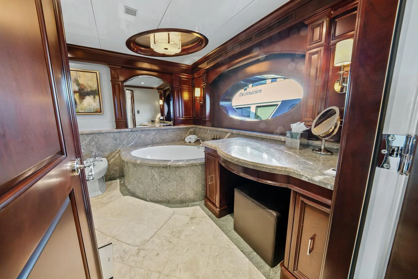 a bathroom with a large mirror aboard NICOLE EVELYN Yacht for Sale