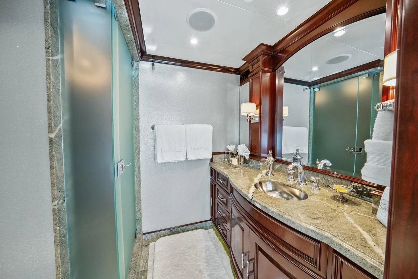 a bathroom with a large mirror aboard NICOLE EVELYN Yacht for Sale