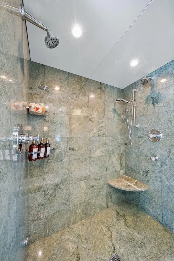 a bathroom with a shower aboard NICOLE EVELYN Yacht for Sale