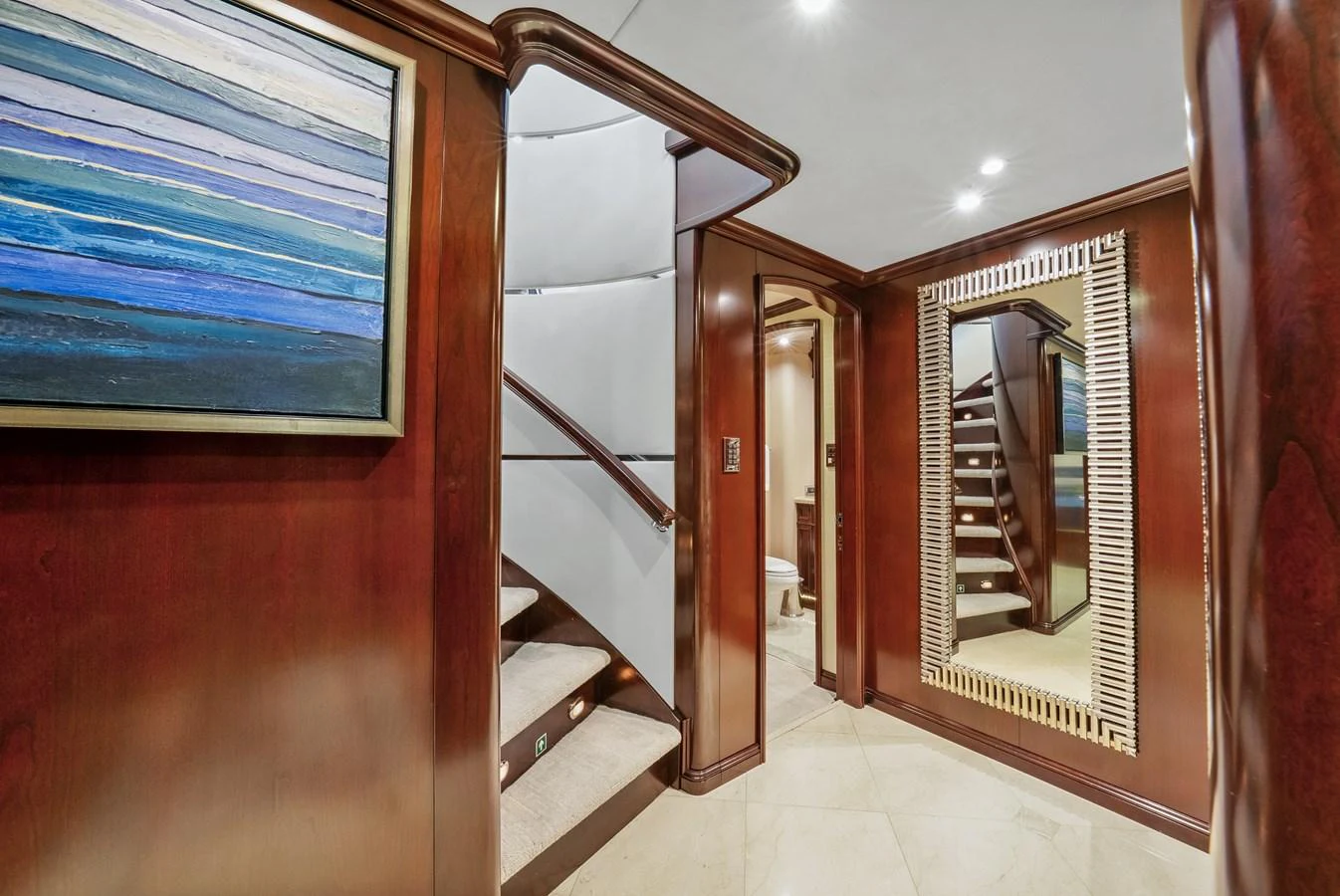 a room with a staircase and a window aboard NICOLE EVELYN Yacht for Sale