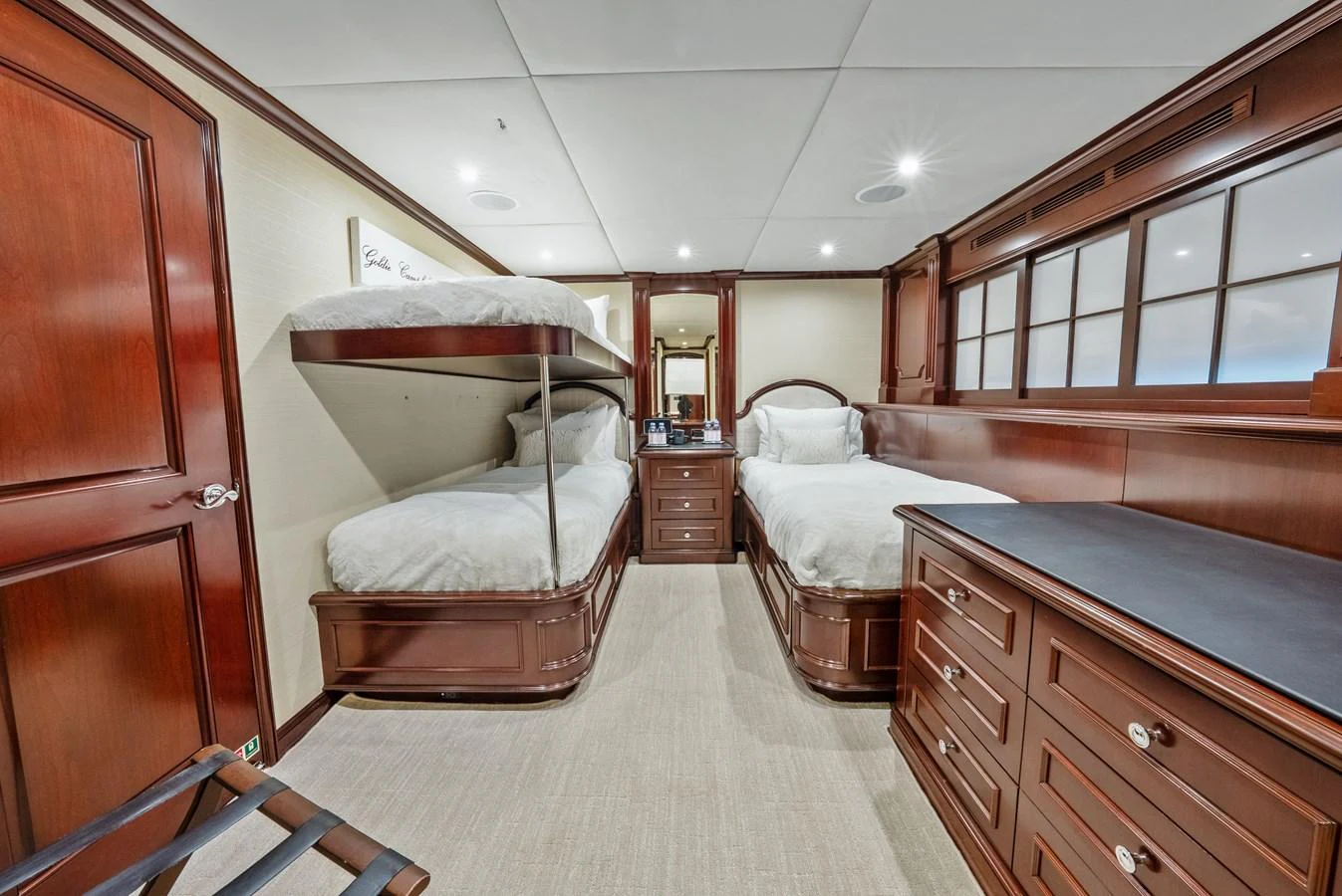 a bedroom with two beds aboard NICOLE EVELYN Yacht for Sale