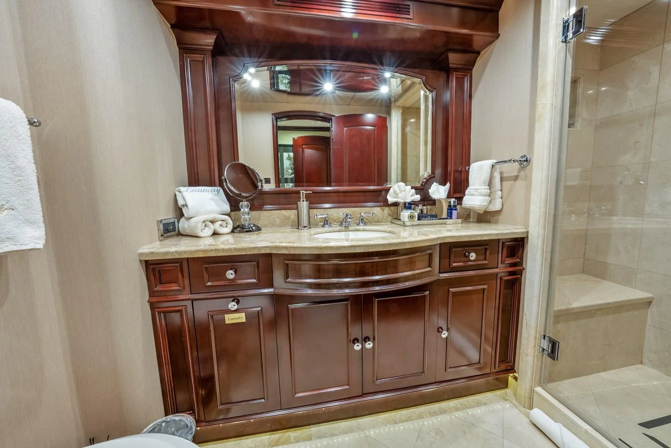 a bathroom with a large mirror aboard NICOLE EVELYN Yacht for Sale