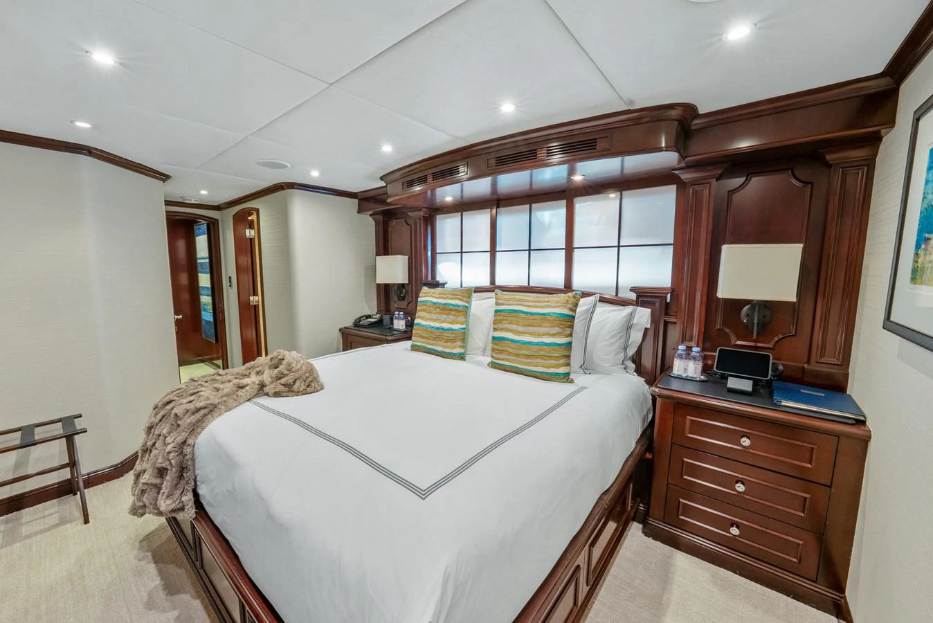 a bedroom with two beds aboard NICOLE EVELYN Yacht for Sale