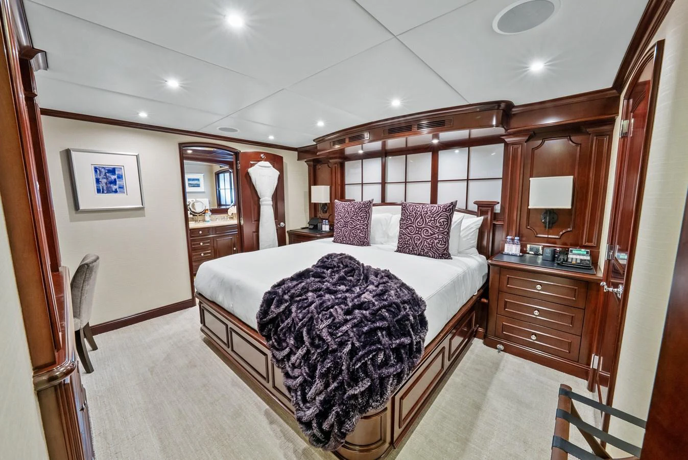 a large bedroom with a large bed aboard NICOLE EVELYN Yacht for Sale