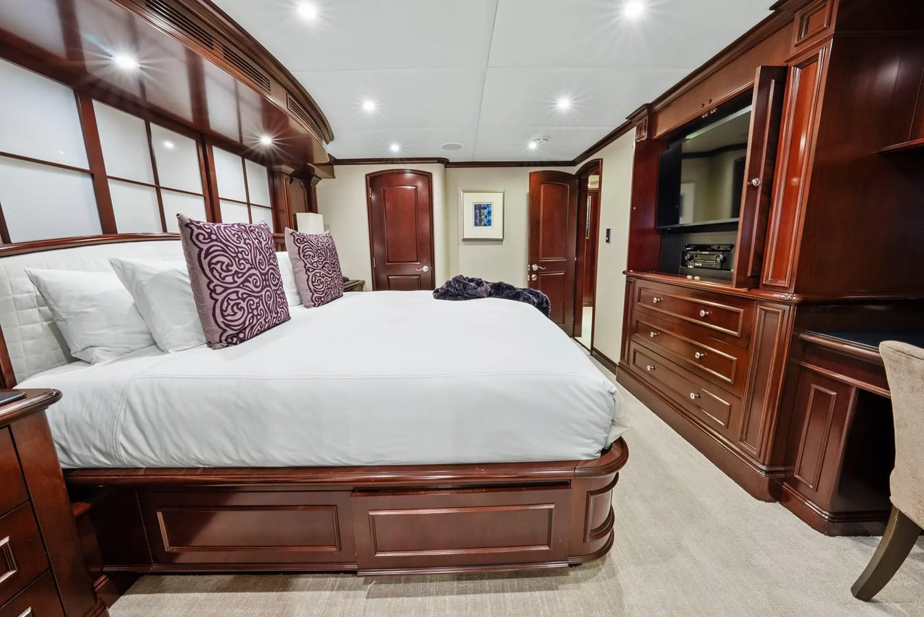 a bed in a room aboard NICOLE EVELYN Yacht for Sale