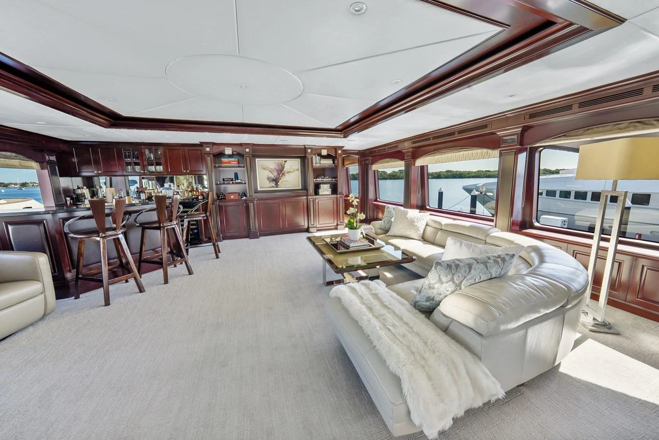 a living room with a couch and a table aboard NICOLE EVELYN Yacht for Sale
