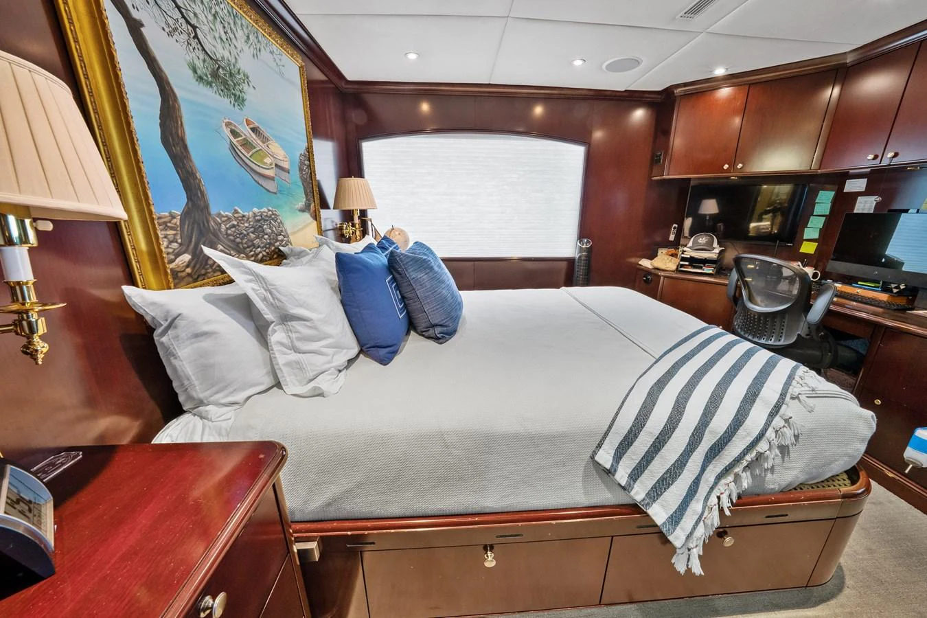 a bed with white sheets aboard NICOLE EVELYN Yacht for Sale