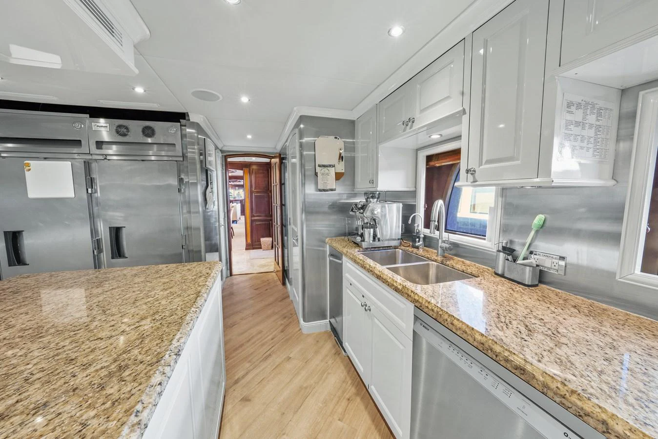a kitchen with a large island aboard NICOLE EVELYN Yacht for Sale