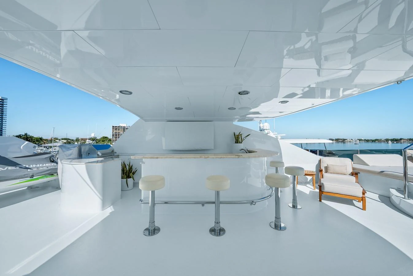a room with tables and chairs aboard NICOLE EVELYN Yacht for Sale