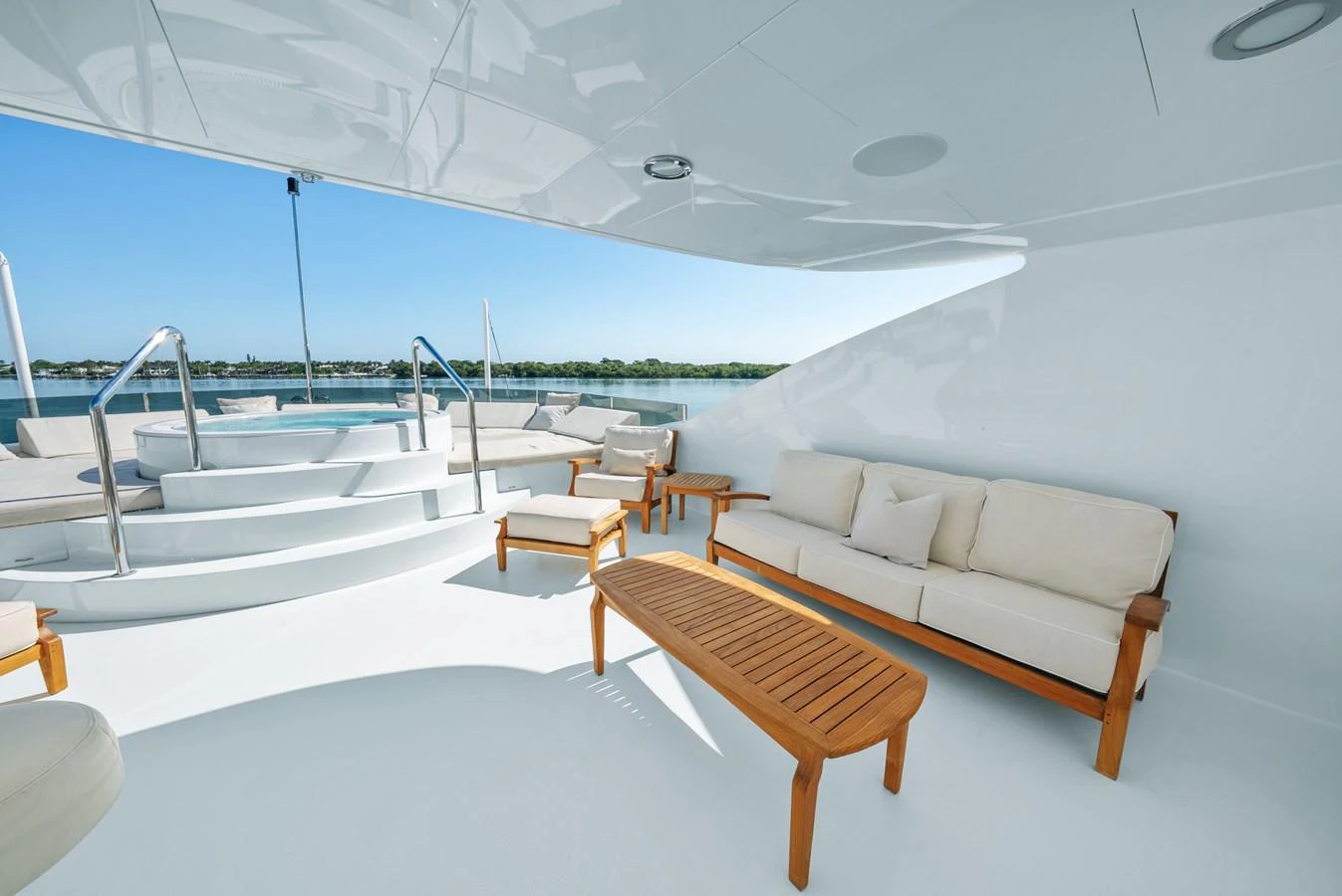 a room with a couch and a table and chairs aboard NICOLE EVELYN Yacht for Sale
