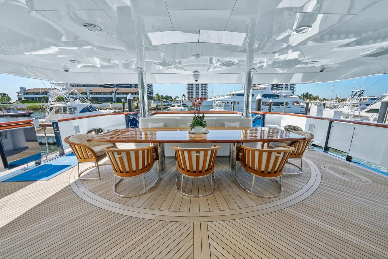 a room with a table and chairs aboard NICOLE EVELYN Yacht for Sale
