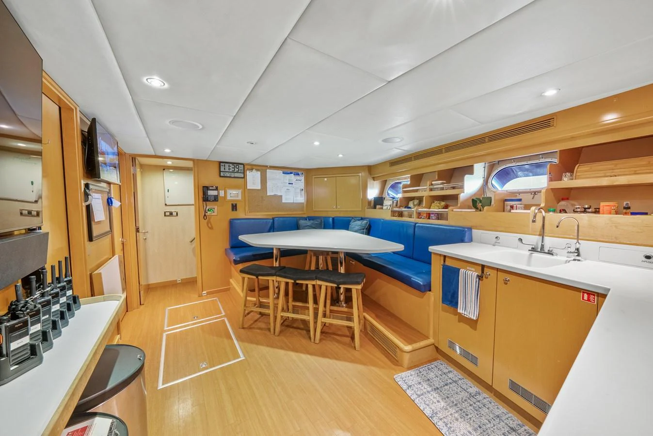 a kitchen with a table and chairs aboard NICOLE EVELYN Yacht for Sale